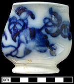 Cup printed in flown blue with a floral motif - Collected by George L. Miller in 1986 in Hanley. Cannot be attributed to a specific pottery. 
